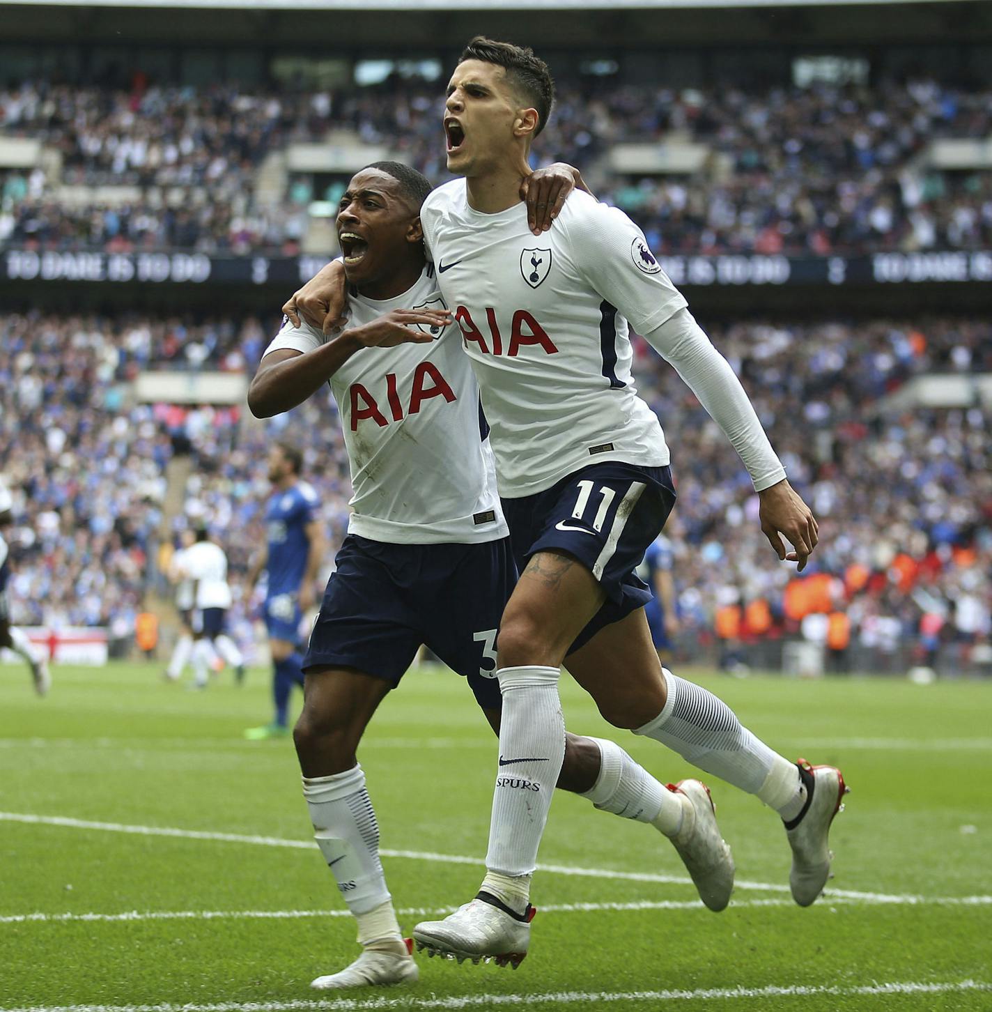 Tottenham Hotspur's Erik Lamela, foreground, celebrates scoring his side's forth goal of the game with teammate Danny Rose during the English Premier League soccer match between Tottenham Hotspur and Leicester City, at Wembley Stadium, in London, Sunday May 13, 2018. (Steven Paston/PA via AP)