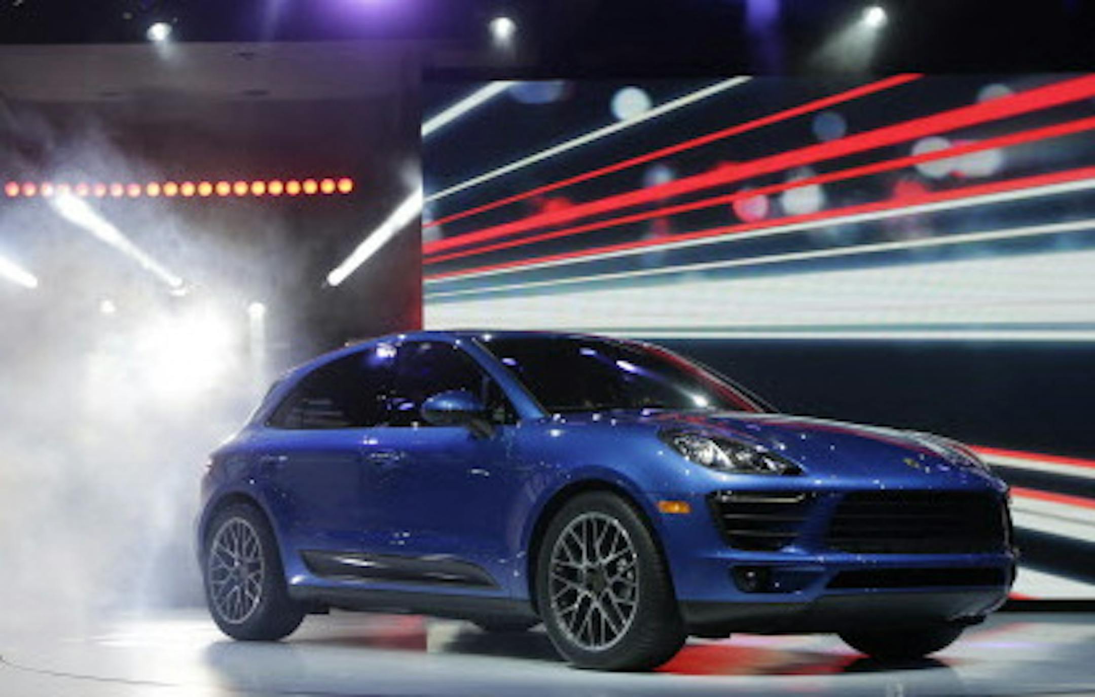 The new Porsche Macan S is introduced at the Los Angeles Auto Show in Los Angeles, Tuesday, Nov. 19, 2013. (AP Photo/Chris Carlson)