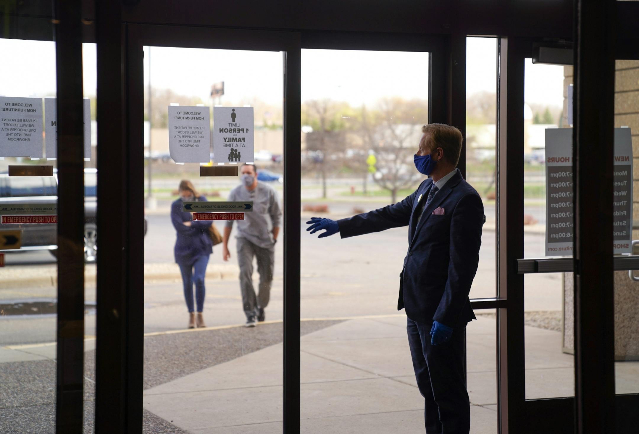 Lakeville HOM Furniture store manager Chad Spilker manually opened the door for customers with appointments. He sanitized the doors after each customer.