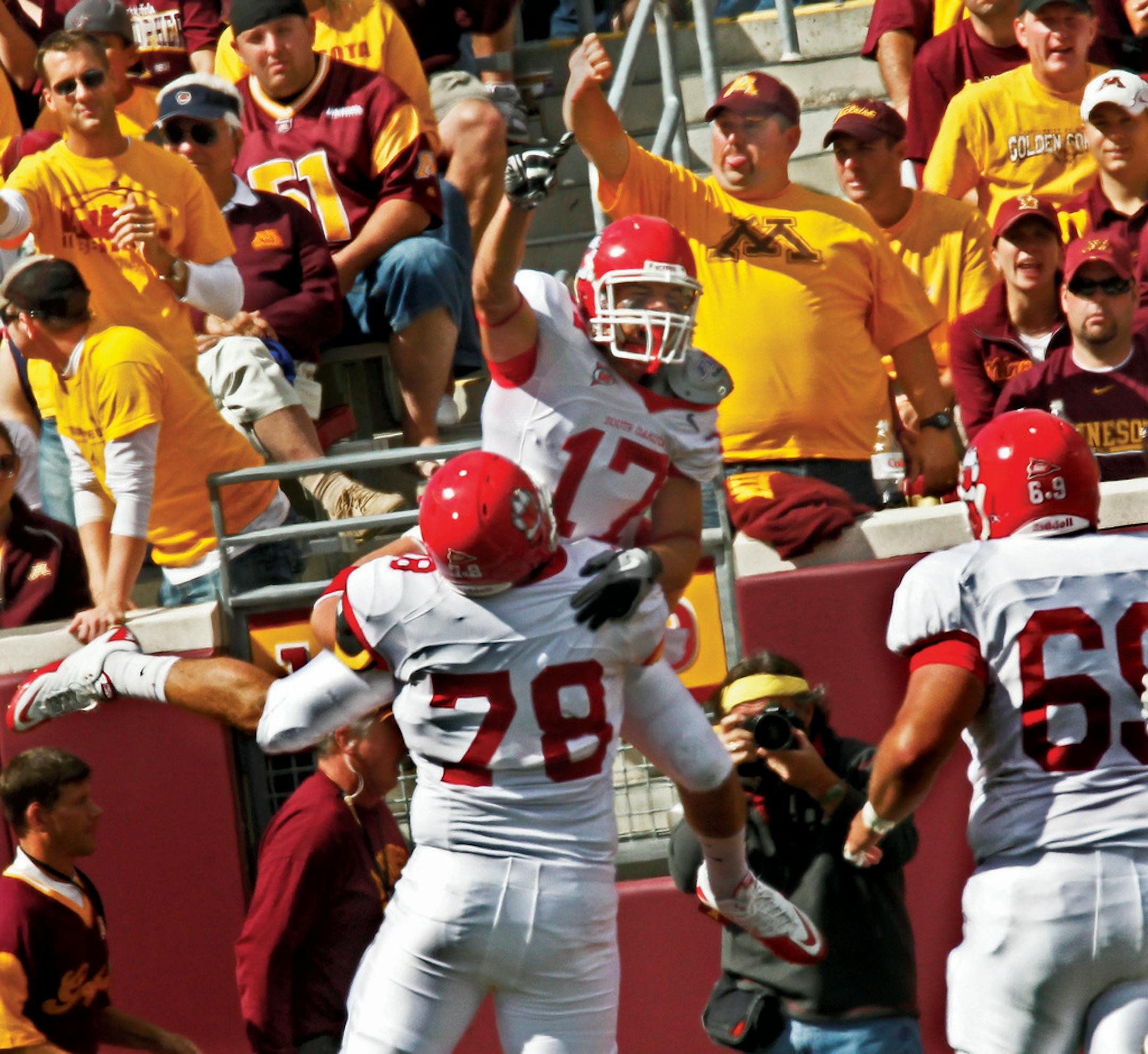 Gophers fans reacted in a negative way after South Dakota's Will Powell (17) celebrated after catching a touchdown pass in the first half.
