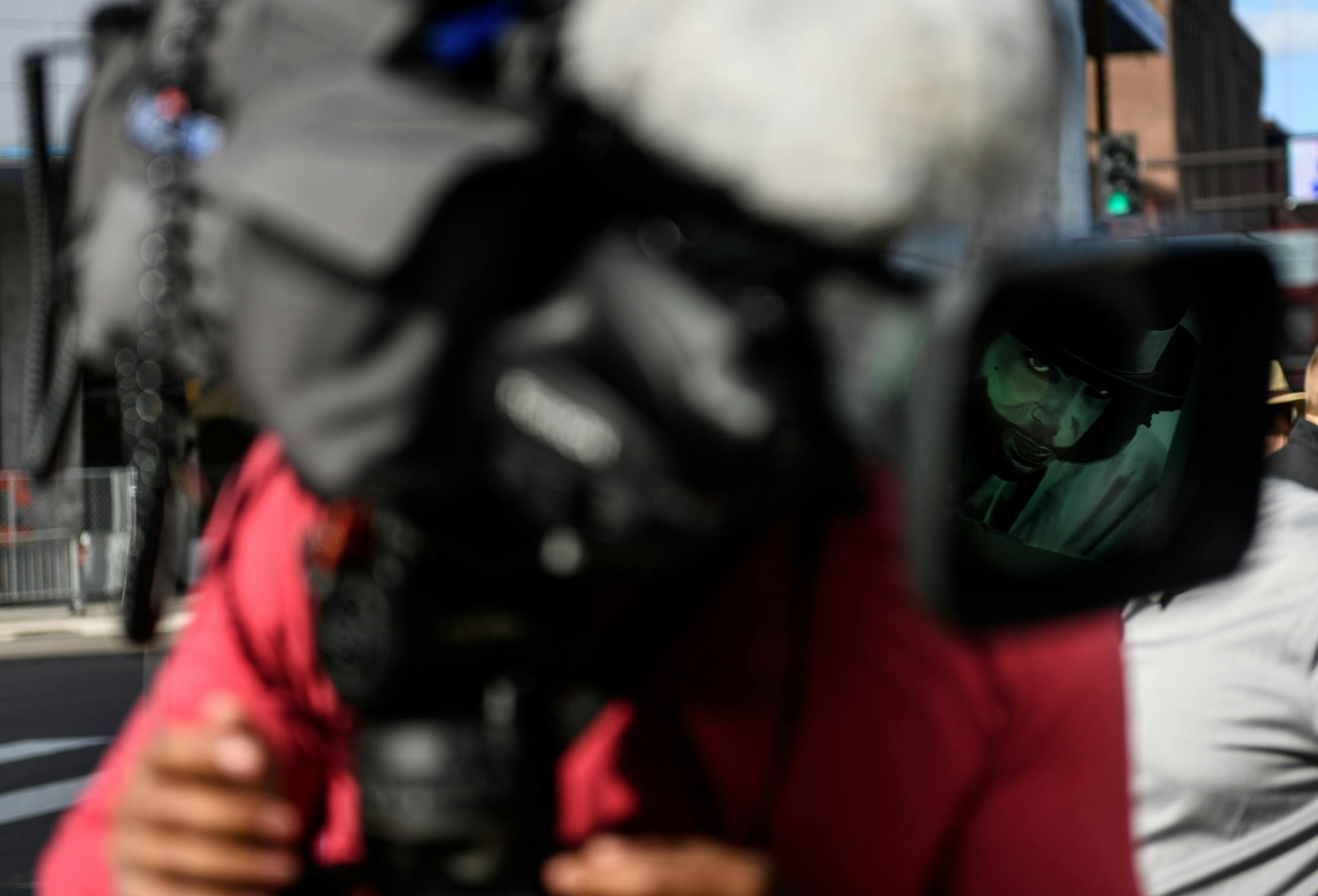 A portrait of Prince was reflected in the lens of a FOX9 videographer's camera Friday afternoon in front of First Avenue.