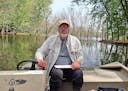 John "Hawk" Stravers listens for cerulean warblers on a backwater of the Mississippi River near his home in McGregor, Iowa. Stravers is a free-sprited