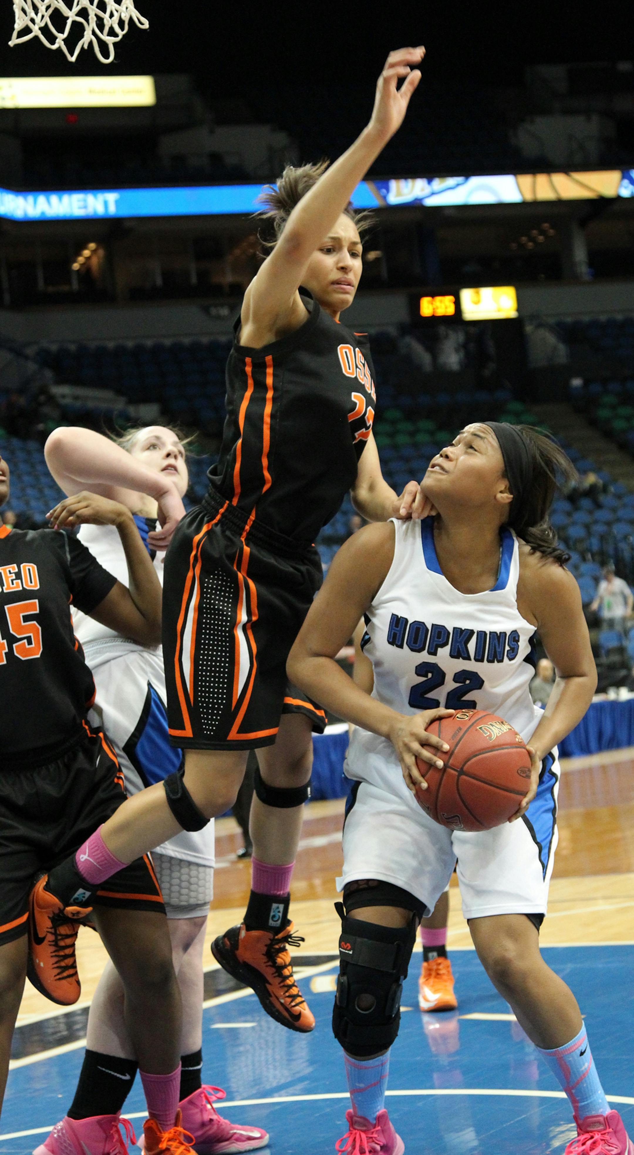 GIRLS BASKETBALL STATE SEMIFINALS Class 4A - Hopkins vs. Osseo. Osseo's Janay Malone prepared to block the shot of Hopkins TT Starks (22). (MARLIN LEVISON/STARTRIBUNE(mlevison@startribune.com (cq -PROGRAM)