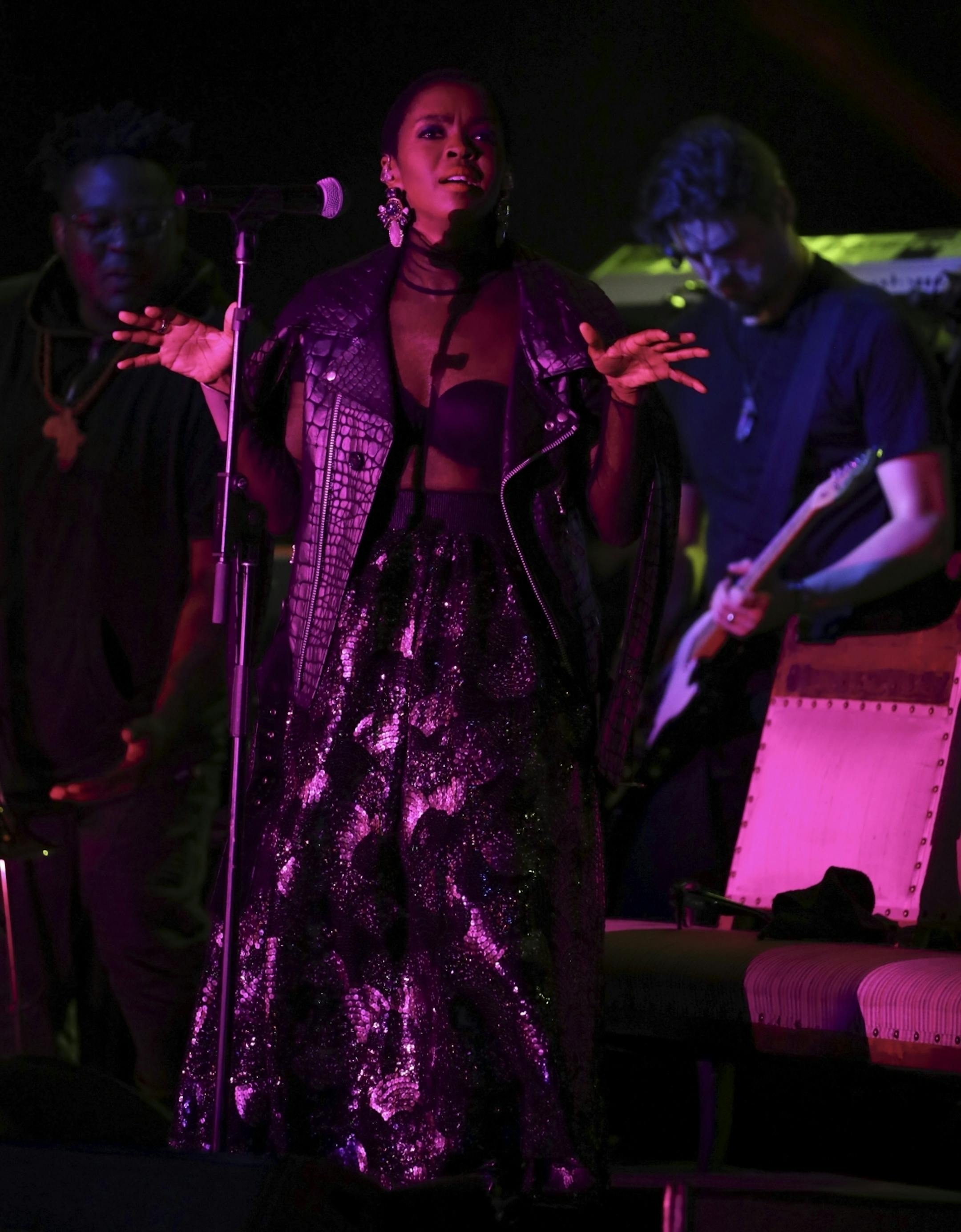 Lauryn Hill on the First Ave. stage with her band early in her set Sunday night.