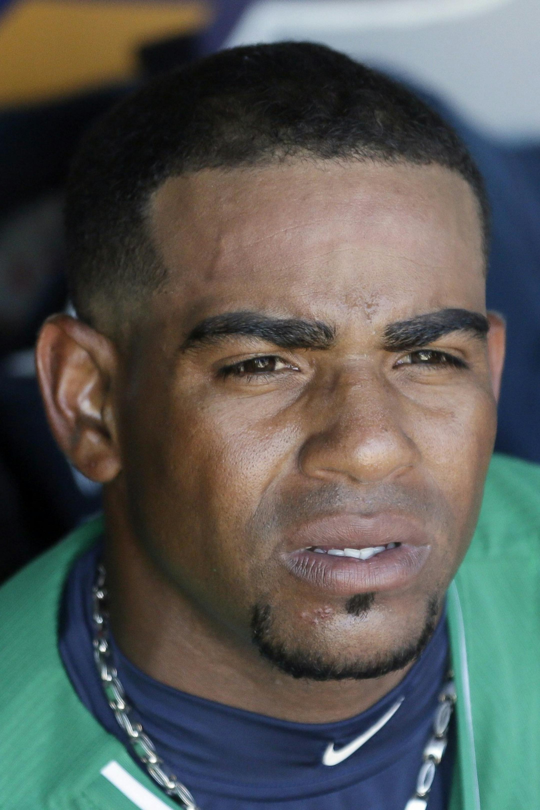 Detroit Tigers left fielder Yoenis Cespedes is seen in the dugout during the fifth inning of a spring training exhibition baseball game against the Washington Nationals in Lakeland, Fla., Tuesday, March 17, 2015. (AP Photo/Carlos Osorio) ORG XMIT: otkco134