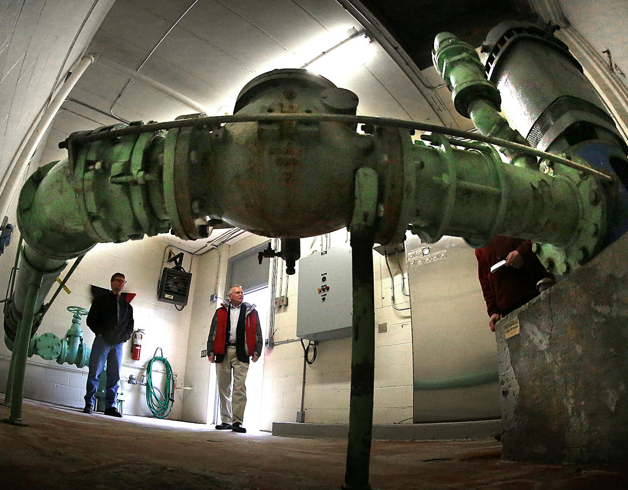 In 1962, Richfield drilled this well 437 feet into the Prairie du Chien aquifer, becoming one of the first suburbs to create a municipal water system using deep wells. Today, after more than 50 years of pumping, the water level in Richfield Well No. 1 is actually six inches higher than when it was drilled. Pictured are Robert Hintgen (dark coat), Richfield utilities supervisor, and Mike Eastling, recently retired as the city’s public works director.