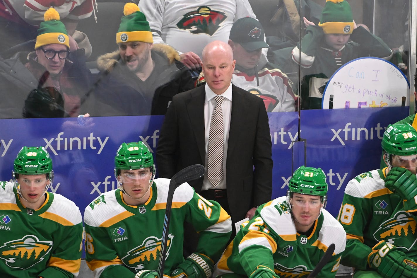 Minnesota Wild head coach John Hynes, center top, watches an NHL hockey game against the Arizona Coyotes during the third period Saturday, Jan. 13, 2024, in St. Paul, Minn. (AP Photo/Craig Lassig)