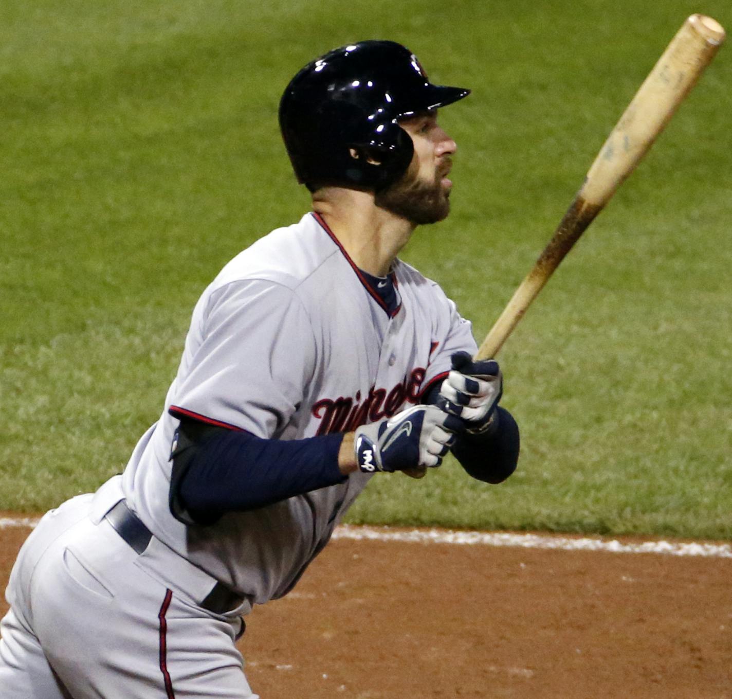 Minnesota Twins' Joe Mauer (7) watches his solo-home run off Pittsburgh Pirates relief pitcher Antonio Bastardo during the thirteenth inning of a baseball game in Pittsburgh Wednesday, May 20, 2015. The Twins won 4-3. (AP Photo/Gene J. Puskar) ORG XMIT: MIN2015061122501991