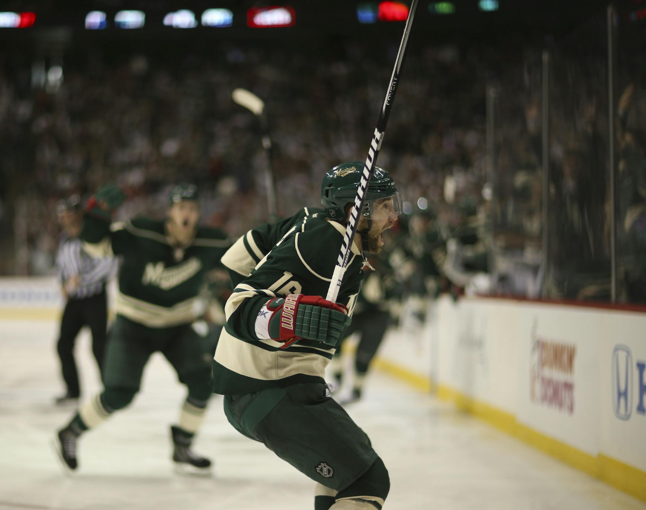 The Minnesota Wild beat the Chicago Black Hawks 3-2 in overtime in game three of their first round playoff series Sunday afternoon, May 25, 2013 at Xcel Energy Center in St. Paul. The Minnesota Wild's Jason Zucker headed for the glass as he celebrated his game winning goal early in the overtime period Sunday afternoon.
