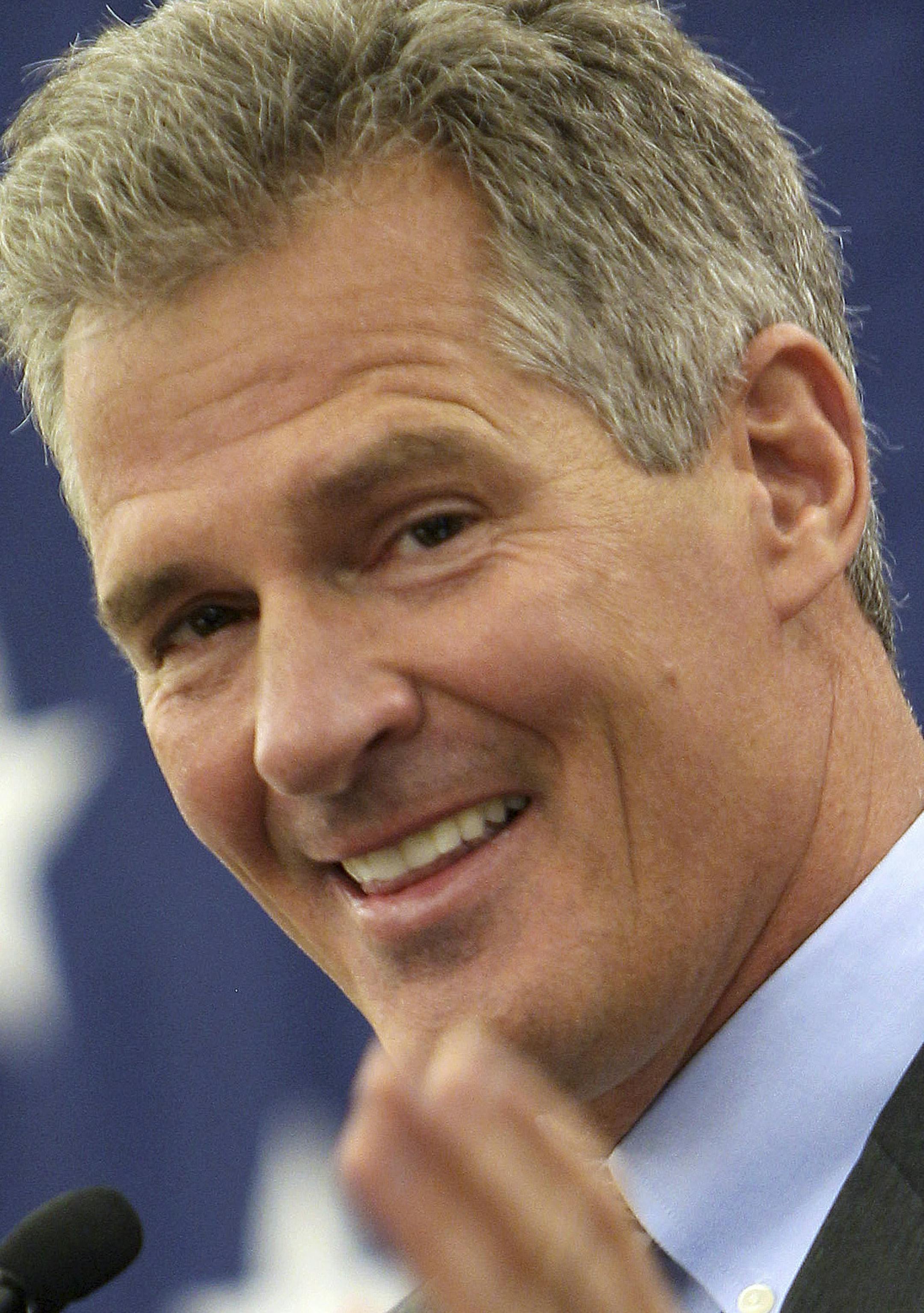 FILE - In this March 14, 2014 file photo, former Massachusetts Senator Scott Brown acknowledges his wife Gail in Nashua, N.H., as he announces plans to form an exploratory committee to enter New Hampshire's U.S. Senate race against Democratic Sen. Jeanne Shaheen. Brown said Monday, April 7, 2014, he will kick off his campaign for U.S. Senate Thursday night in Portsmouth, N.H. (AP Photo/Jim Cole, File)