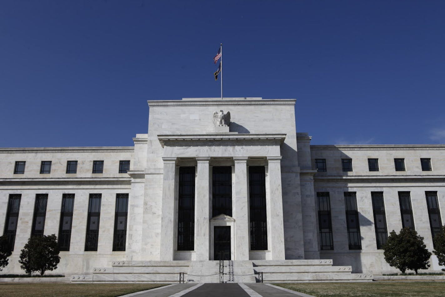 The Federal Reserve building is seen in Washington, Wednesday, March 18, 2009, after it announced that it will spend up to $300 billion over the next six months to buy long-term government bonds, a new step aimed at lifting the country out of recession by lowering rates on mortgages and other consumer debt. (AP Photo/Charles Dharapak)