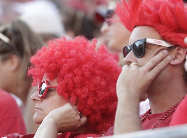 Wisconsin fans watch during the second half of an NCAA college football game against BYU Saturday, Sept. 15, 2018, in Madison, Wis. BYU won 24-21. (AP