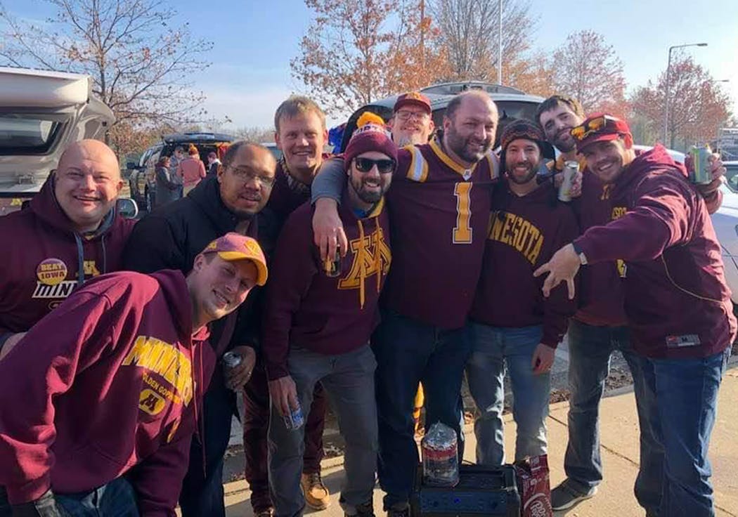 Matt Painschab, middle with the stocking hat and sunglasses, with friends at the 2019 Gophers-Iowa football game.