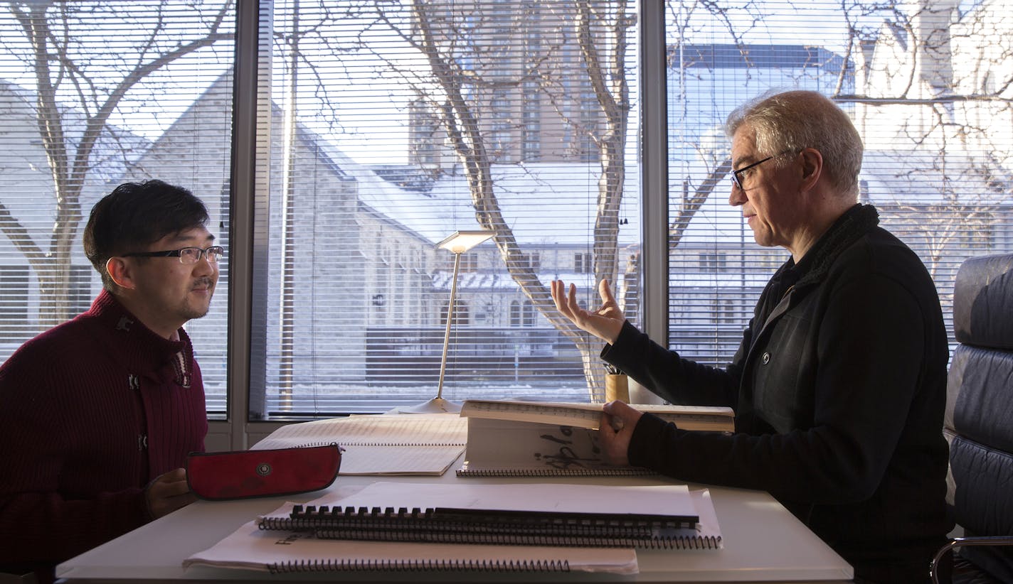 Osmo Vanska, conductor of the Minnesota Orchestra, talks with Texu Kim about his piece "Splash!!" before rehearsal for the 12th annual Minnesota Orchestra Composer Institute concert at Orchestra Hall Auditorium in Minneapolis on Thursday, January 15, 2015. The concert will take place at 8 p.m. on Friday, January 16. ] LEILA NAVIDI leila.navidi@startribune.com /