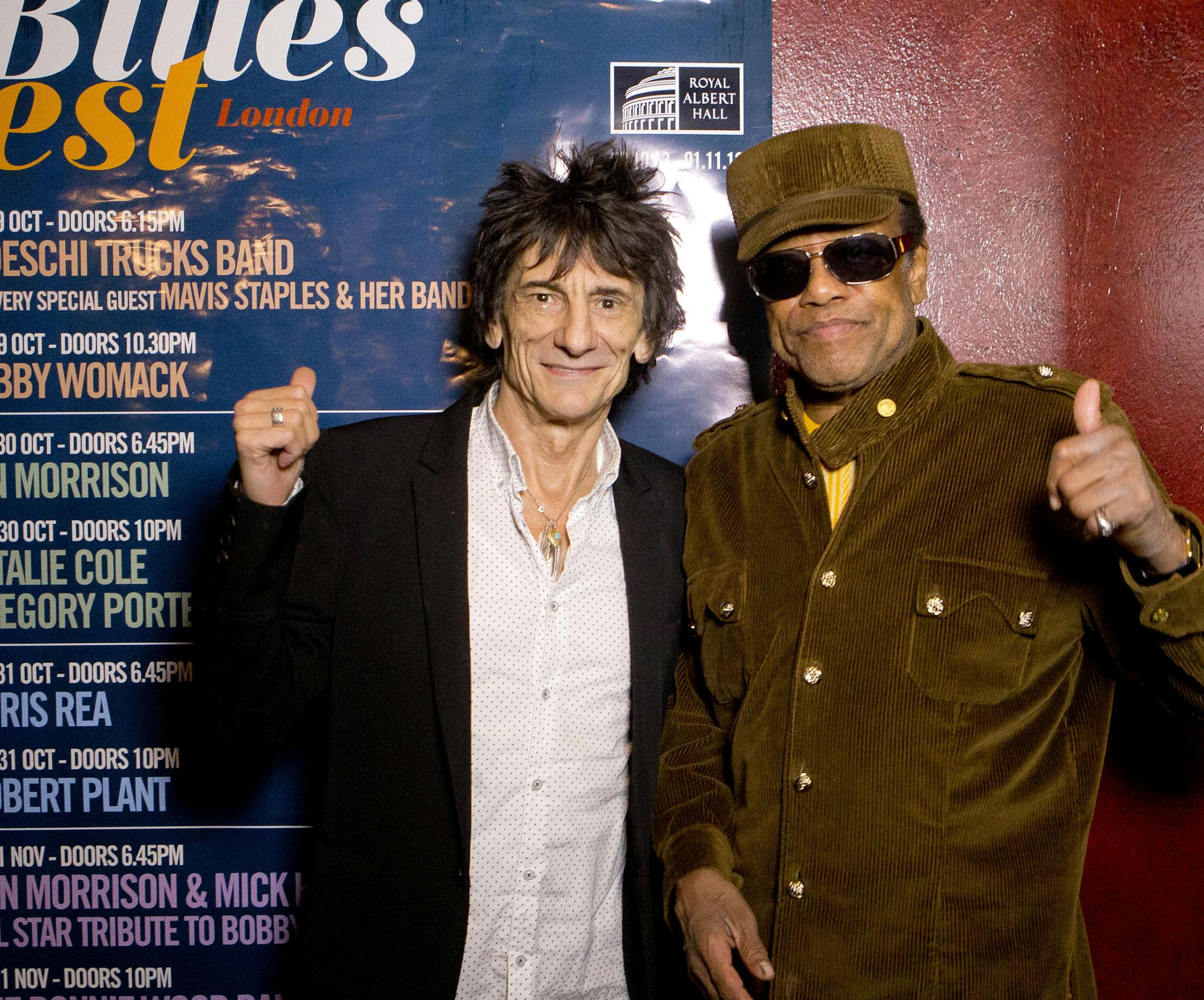 British musician Ronnie Wood, centre, poses with U.S singer/songwriter Bobby Womack before presenting him with the 'Bluesfest Lifetime Achievement Award' for Services To Soul', at the Royal Albert Hall in west London, Monday, Oct. 28, 2013. (Photo by Joel Ryan/Invision/AP)