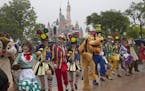 Performers take part in a parade at the Disney Resort in Shanghai, China, Wednesday, June 15, 2016 on the eve of its grand opening. The debut of Shang