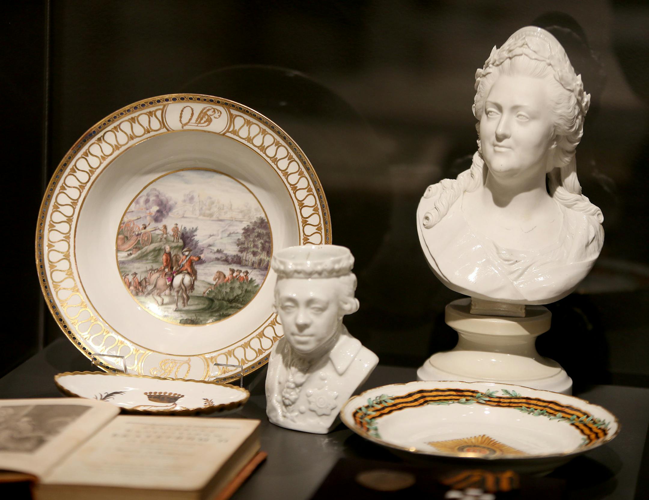 Curator Masha Zavialova prepared "The Romanovs: Legacy of an Empire Lost," at the Museum of Russian Art, Friday, November 15, 2013. The show is of memorabilia of three centuries of costumes, photos, paintings, books, jewelry from 15 museums and private collections, documenting the history of Russia's czars whose rule ended in bloody revolution of 1917. (ELIZABETH FLORES/STAR TRIBUNE) ELIZABETH FLORES • eflores@startribune.com