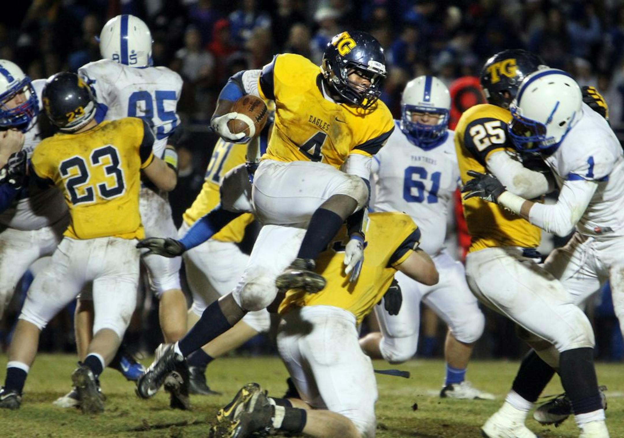 Totino-Grace's Kez Flomo (4) was an integral part of his team's offense during their game against Spring Lake Park at Totino-Grace High School in Fridley November 2, 2012.