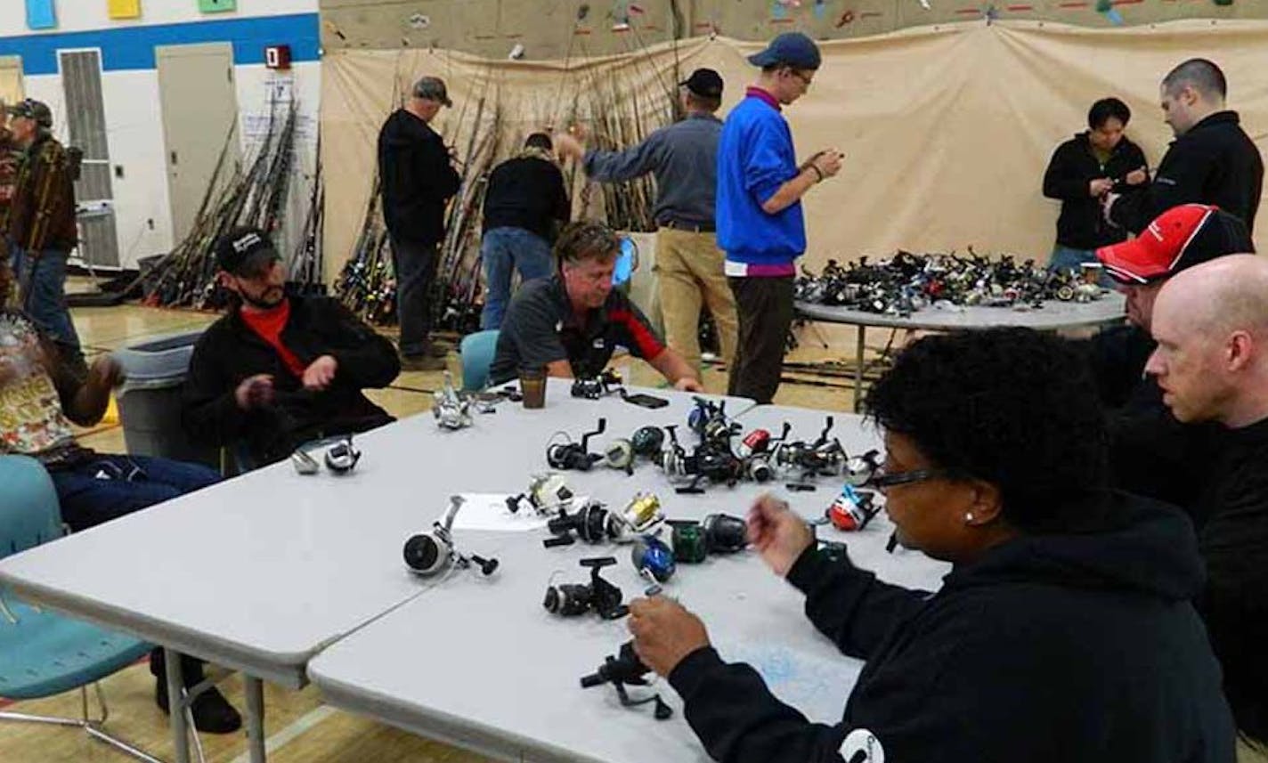 Courtesy of Fishing for Life Volunteers repair and prepare fishing gear at a Rod Rebuilding Day event.