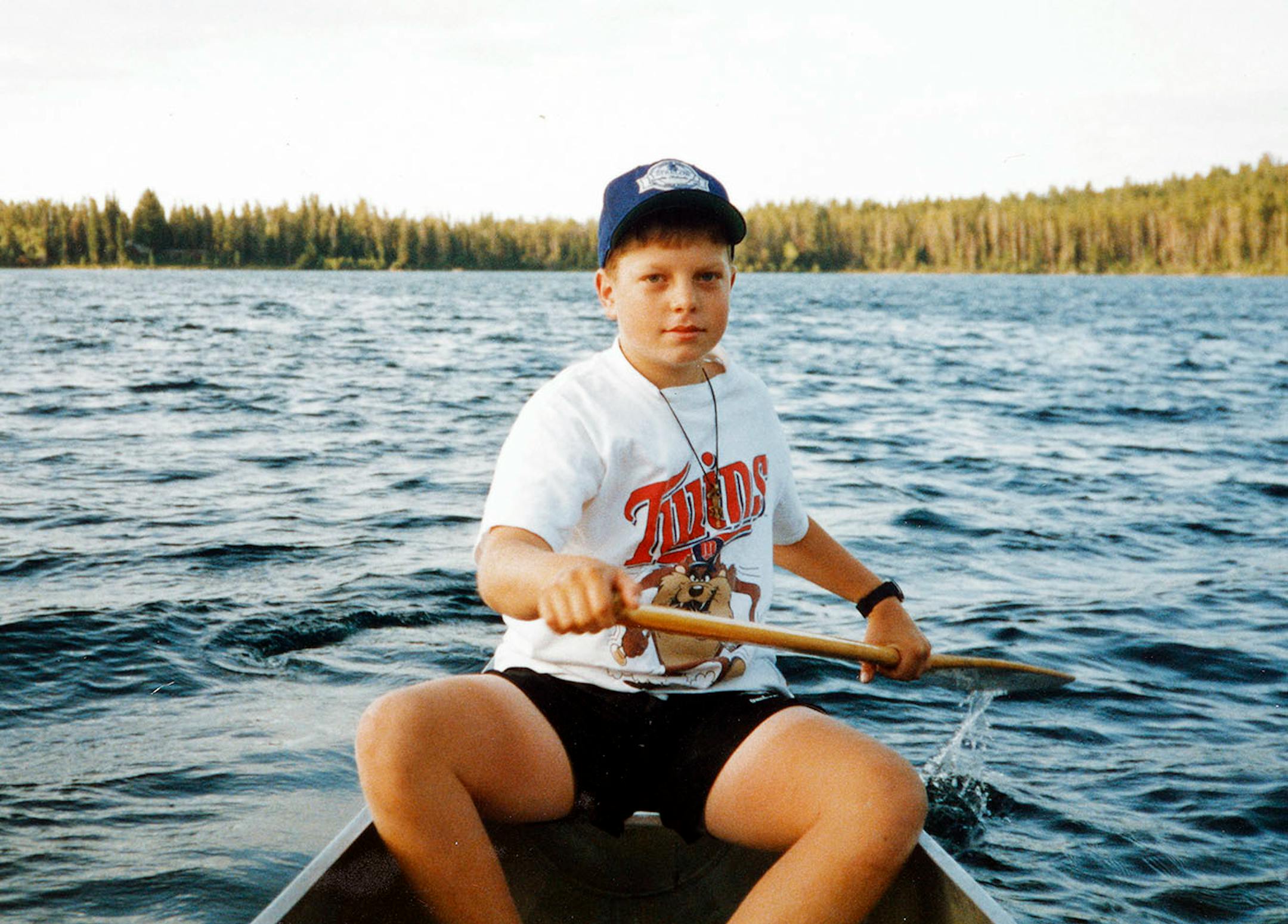 Eric Dayton canoeing on a northern Minnesota lake as a youth.
