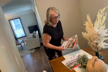 Shelly Billiet of Edina Realty prepares for an open house at a three-bedroom house she has listed in St. Louis Park for $389,900.