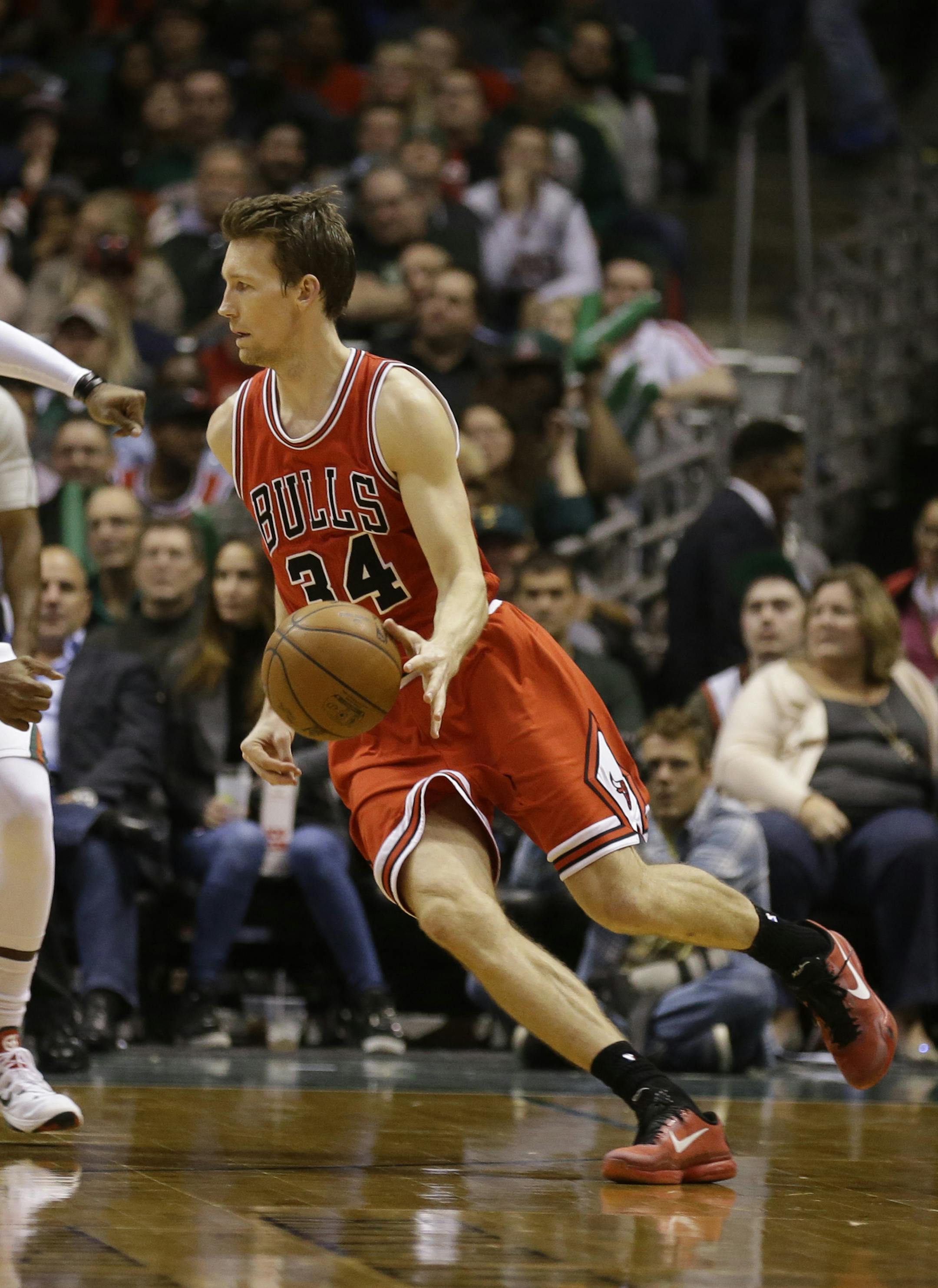 Chicago Bulls' Mike Dunleavy (34) drives against the Milwaukee Bucks' O.J. Mayo during the second half of Game 6 of an NBA basketball first-round playoff series Thursday, April 30, 2015, in Milwaukee. (AP Photo/Jeffrey Phelps)