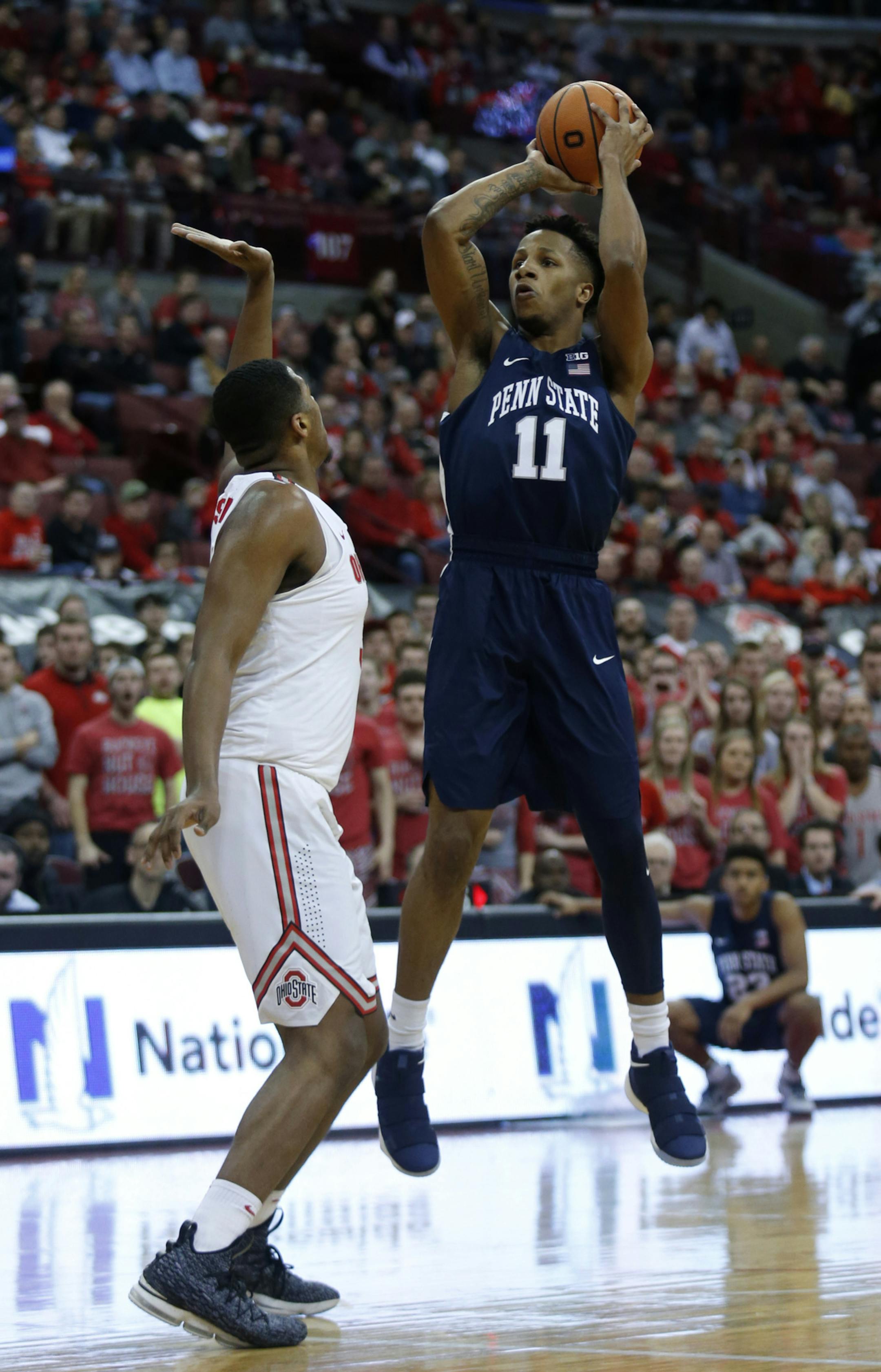 Penn State forward Lamar Stevens, right, goes up to shoot against Ohio State forward Jae'Sean Tate during the first half of an NCAA college basketball game in Columbus, Ohio, Thursday, Jan. 25, 2018. (AP Photo/Paul Vernon)
