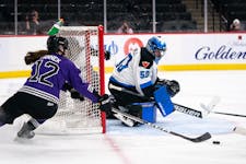Minnesota forward Kelly Pannek (12) tries to poke in a rebound on Toronto goalie Kristen Campbell in the second period of a PWHL semifinal at Xcel Ene