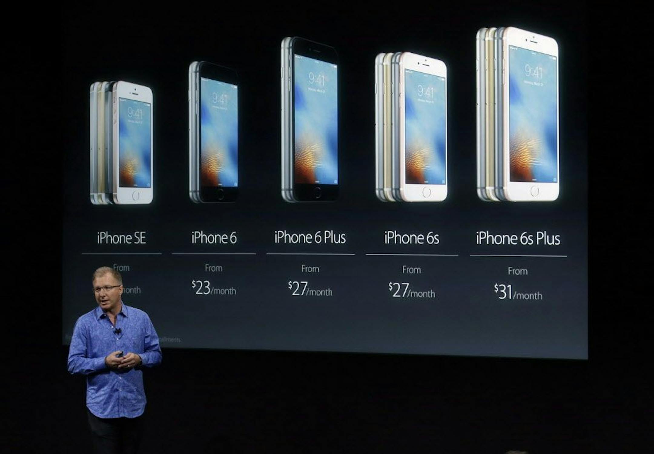 Greg Joswiak, vice president of iOS, iPad and iPhone product marketing, announces the new iPhone SE at Apple headquarters Monday, March 21, 2016, in Cupertino, Calif.