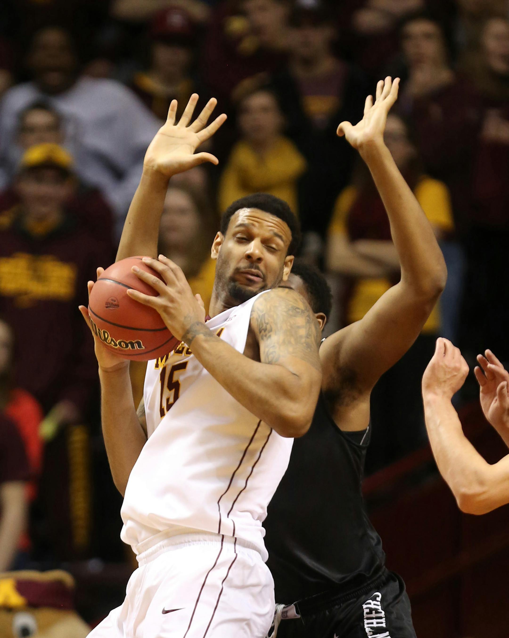Gopher Maurice Walker made a move to the basket with High Point defending in the first half against High Point. ] (KYNDELL HARKNESS/STAR TRIBUNE) kyndell.harkness@startribune.com First round of the National Invitational Tournament at Williams Arena in Minneapolis Min, Tuesday March 18, 2014.