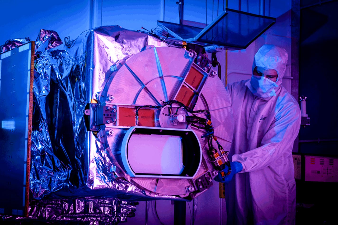 An undated photo provided by Ball Aerospace shows a technician inspecting the Tropospheric Emissions: Monitoring of Pollution instrument, a geostationary ultraviolet/visible spectrometer that will provide daylight measurements of various pollutants. (Ball Aerospace via The New York Times) — NO SALES; FOR EDITORIAL USE ONLY WITH NYT STORY SLUGGED AIR QUALITY SATELLITE BY DELGER ERDENESANAA FOR AUG. 24, 2023. ALL OTHER USE PROHIBITED. —