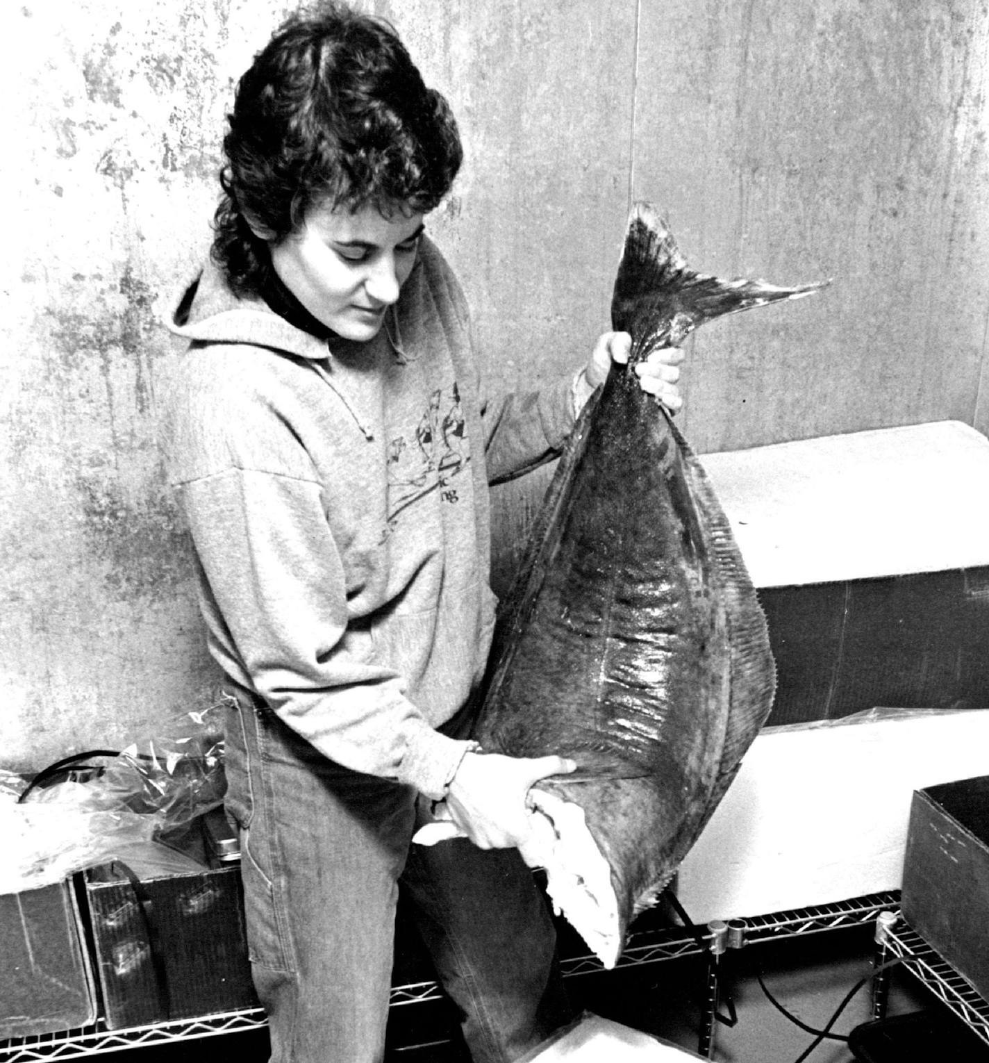 September 30, 1982 Suzanne Weinstein, who used to work with computers, hoisted a halibut at her small Minneapolis distributorship, Coastal Seafoods. September 29, 1982 Donald Black, Minneapolis Star Tribune