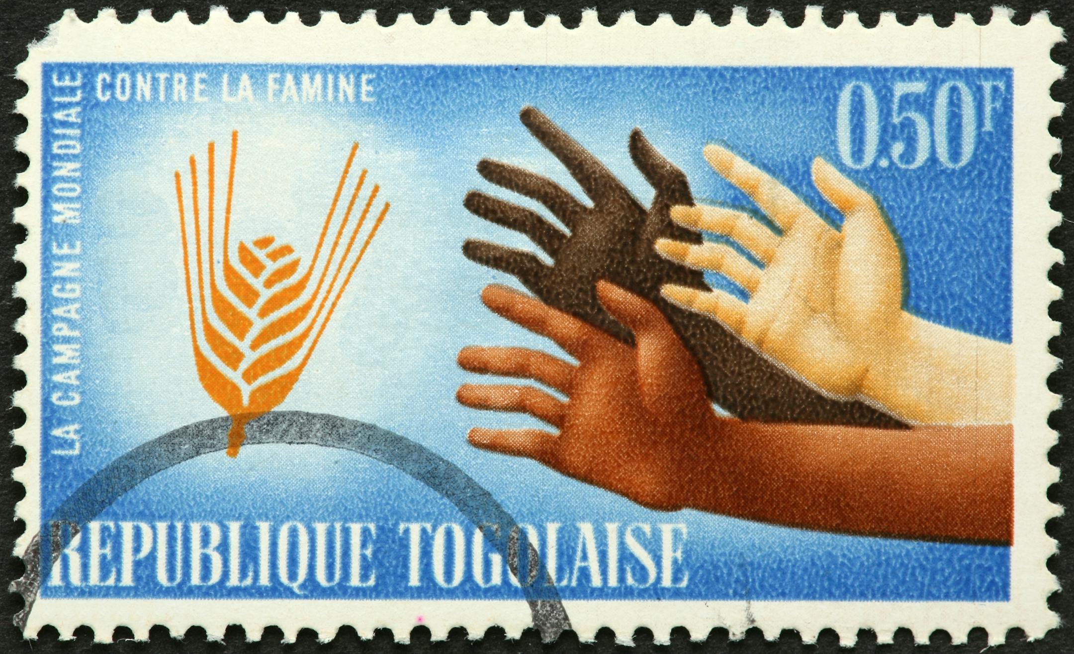 A postage stamp from Togo depicts a theme of food production and demand.
