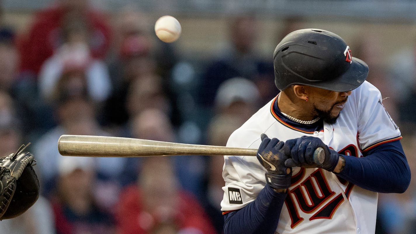 Minnesota Twins' Byron Buxton is hit by a pitch in the fourth inning of a baseball game against the Cincinnati Reds, Monday, June 21, 2021, in Minneapolis. (Carlos Gonzalez/Star Tribune via AP)