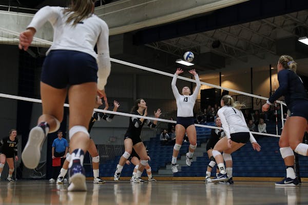 Concordia St. Paul's Elizabeth Mohr (13) set the ball in a match against Wayne State last month.