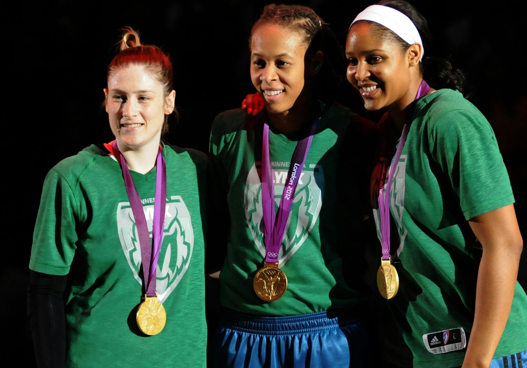 The Minnesota Lynx hosted the Washington Mystics at Target Center August 17, 2012, to kick off the second half of the season. Before the star of the game the 3 Lynx gold medalist were honored at center court they are from l to right Lindsay Whalen , Seimone Augustus and Maya Moore