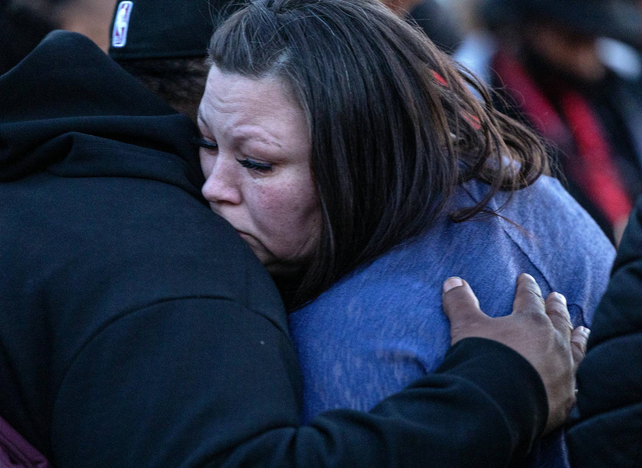 Katie and Aubrey Wright parents of Daunte Wright hug at a Vigil honoring Daunte Wright on one-year anniversary of his death Monday, April 11, in Brooklyn Center, Minn.