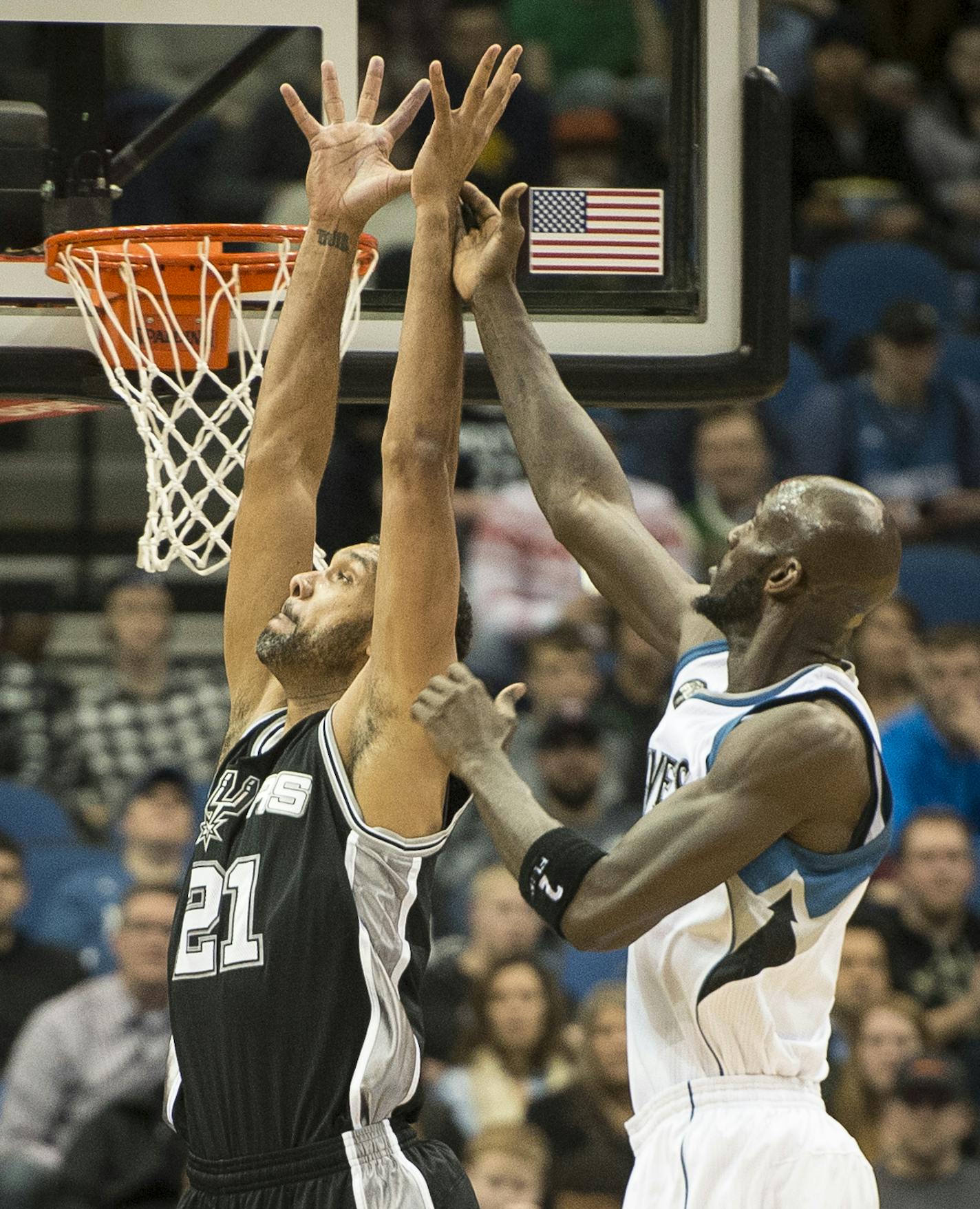 San Antonio Spurs center Tim Duncan (21) and Minnesota Timberwolves forward Kevin Garnett (21) went up for a layup in the first quarter Wednesday. ] (AARON LAVINSKY/STAR TRIBUNE) aaron.lavinsky@startribune.com The Minnesota Timberwolves played the San Antonio Spurs on Wednesday, Dec. 23, 2015 at Target Center in Minneapolis, Minn.