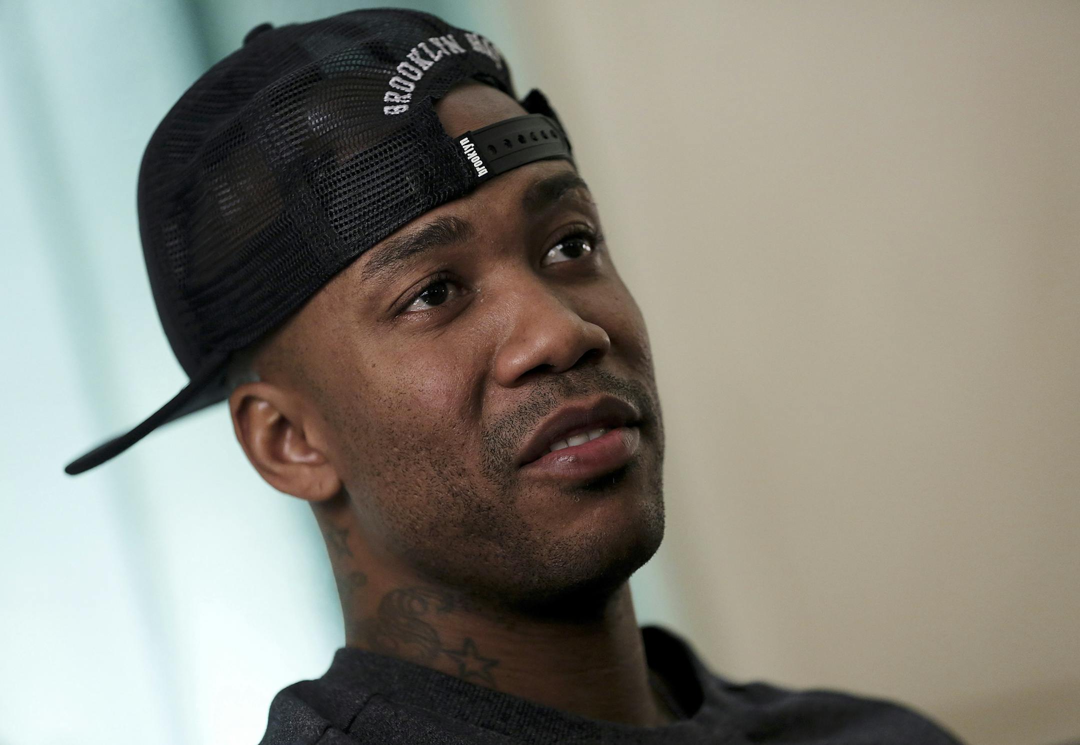 In this Nov. 18, 2014 photo, U.S. basketball player Stephon Marbury speaks during an interview in the lobby of his apartment building in Beijing. After a tumultuous career in the NBA, Marbury says he’s found a new peace in China, thriving on the court with the Beijing Ducks and mentoring young Chinese teammates. (AP Photo/Andy Wong)