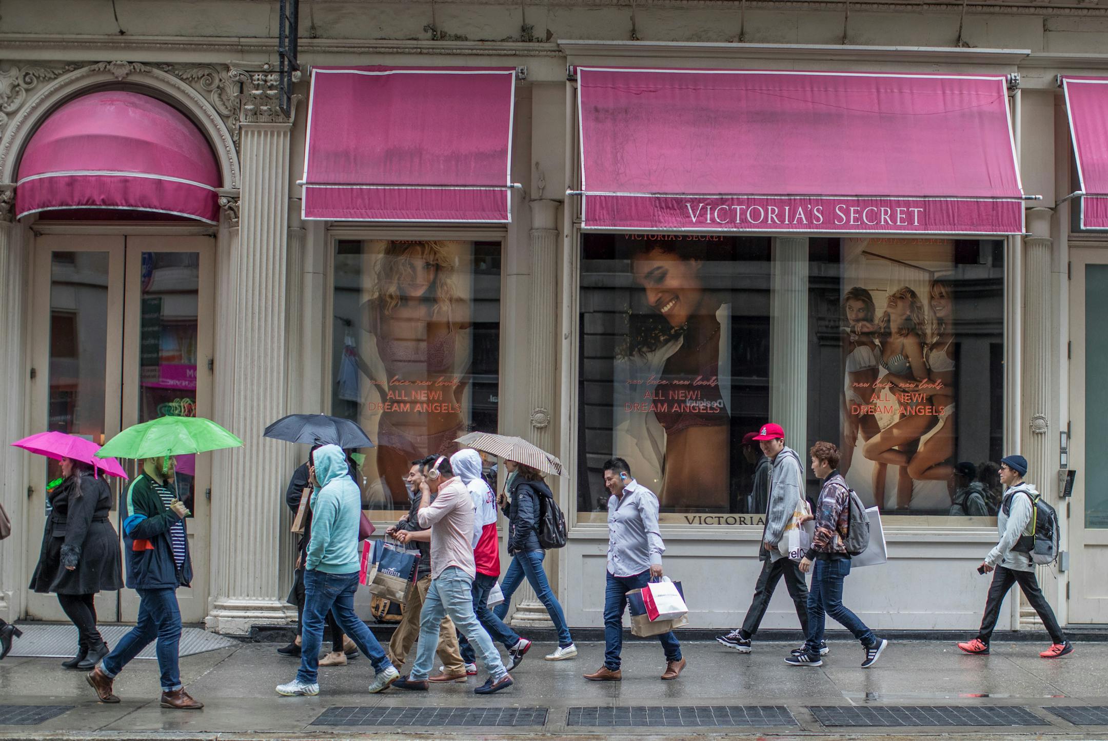 FILE- In this April 4, 2018, file photo, shoppers walk past the Victoria's Secret store on Broadway in the Soho neighborhood of New York. On Monday, April 30, the Commerce Department issues its March report on consumer spending. (AP Photo/Mary Altaffer, File)