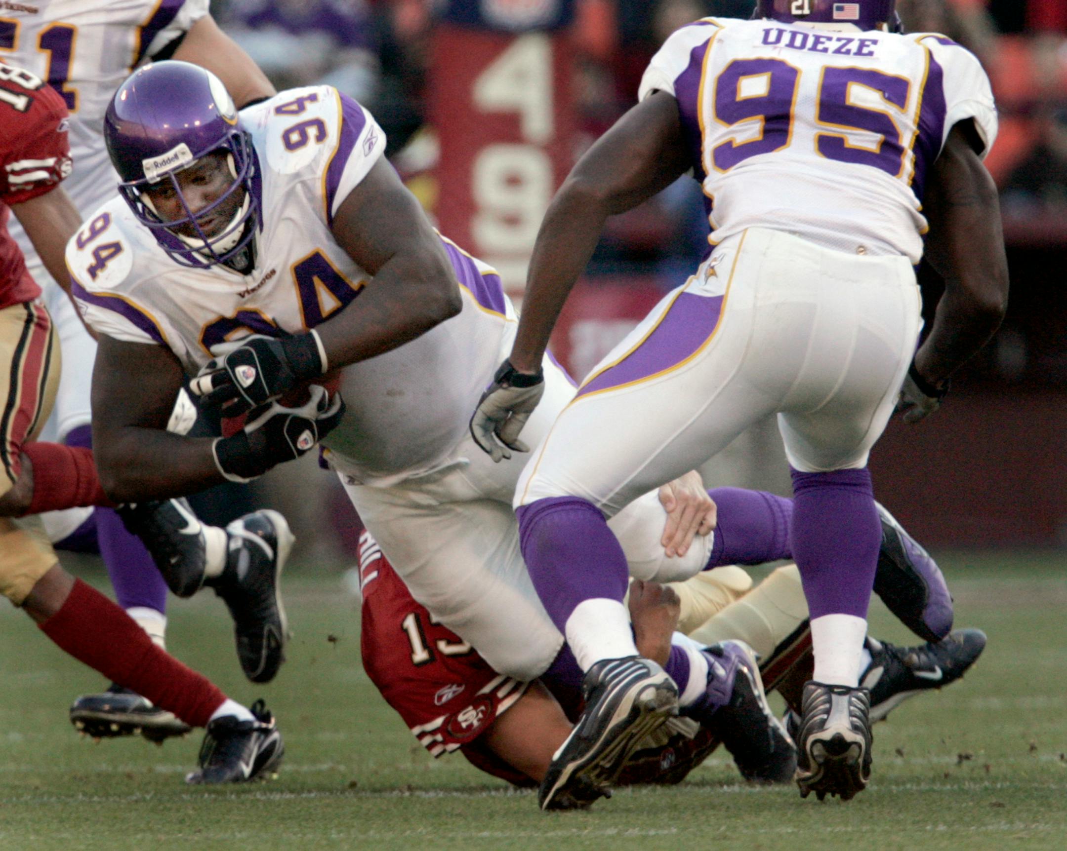 Pat Williams (94) was tackled by quarterback Shaun Hill (12) after an interception in the third quarter.