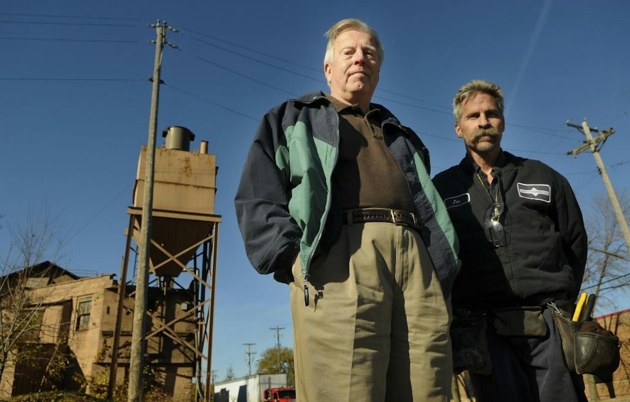 Smith Foundry President Neil Ahlstrom and maintenance supervisor Joe Nelson stood in front of a huge sand tank on Friday November 4th, 2011 in Minneapolis Minn. Smith foundry, which borders the Midtown Greenway at Longfellow Ave., can't get clearance to make improvements because the city of Minneapolis rezoned the property adjacent to what was once a rail line that served industrial businesses that are declining in number. It's a classic Catch 22 for Smith, which is heading for record employment