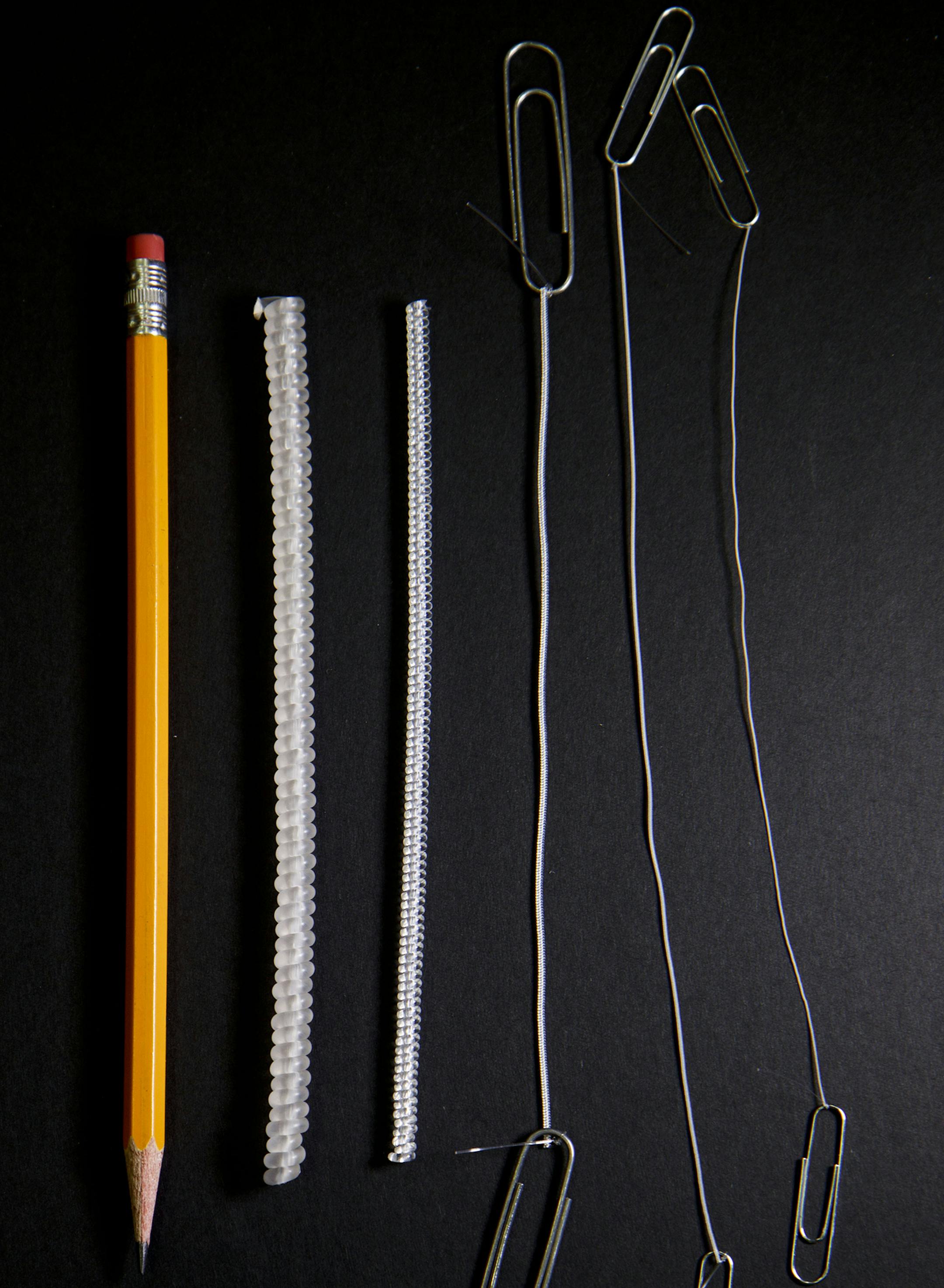 University of Texas at Dallas researchers have made artificial muscles of various sizes by twisting and coiling ordinary fishing line. Pencil and paper clips are included for perspective. Illustrates MUSCLE (category a), by Robert F. Service © 2014, Science/AAAS. Moved Friday, Feb.28, 2014. (MUST CREDIT: Image courtesy of University of Texas at Dallas)