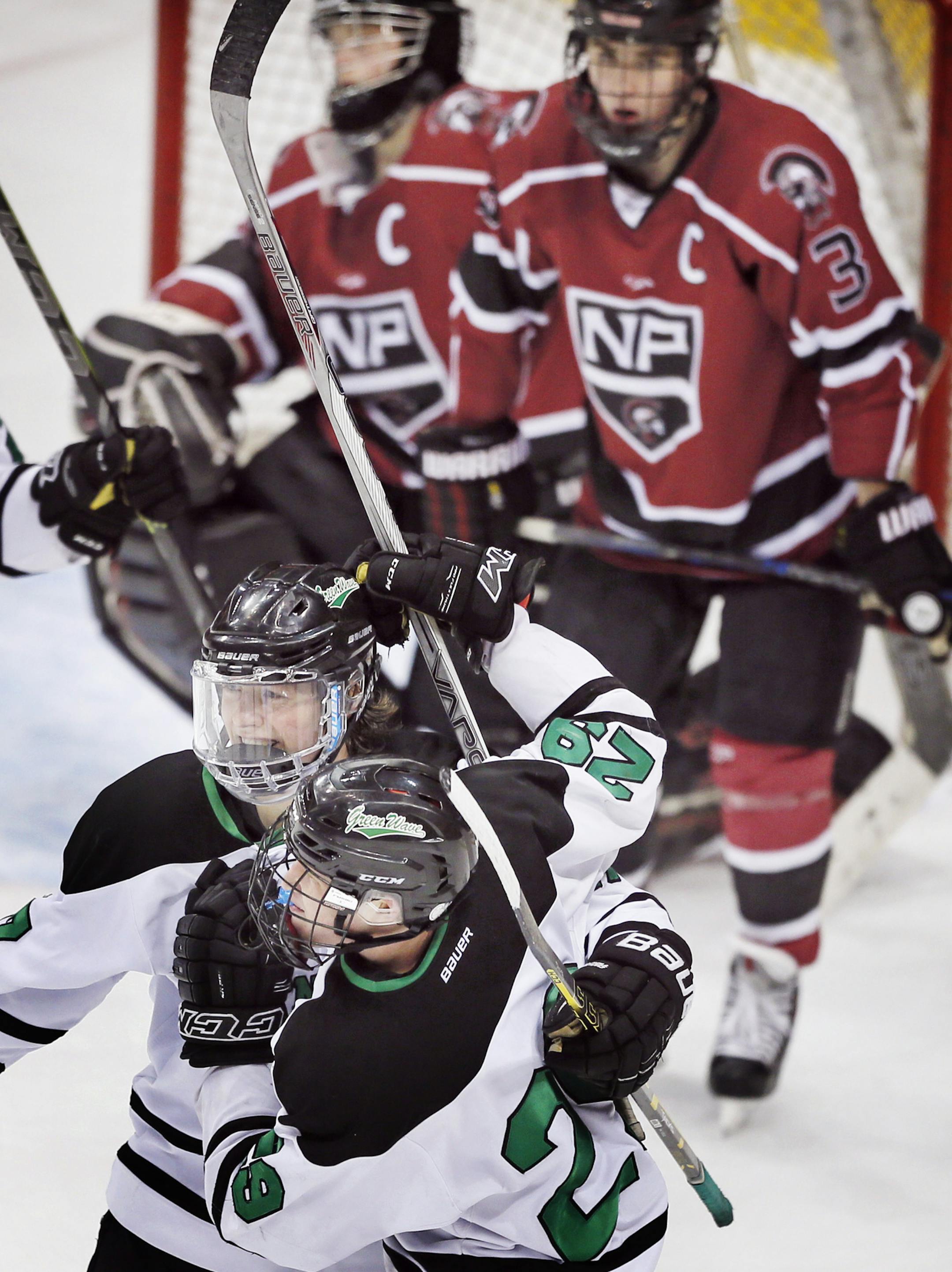 Nick Derrick left of East Grand Forks celebrated his third period goal with Grant Loven. East Grand Forks beat New Prague 4-0 in Class 1A quarterfinals boy's hockey state tournament at the Xcel Energy Center Wednesday March 4, 2015 in St. Paul, Minnesota. ] Jerry Holt/ Jerry.Holt@Startribune.com