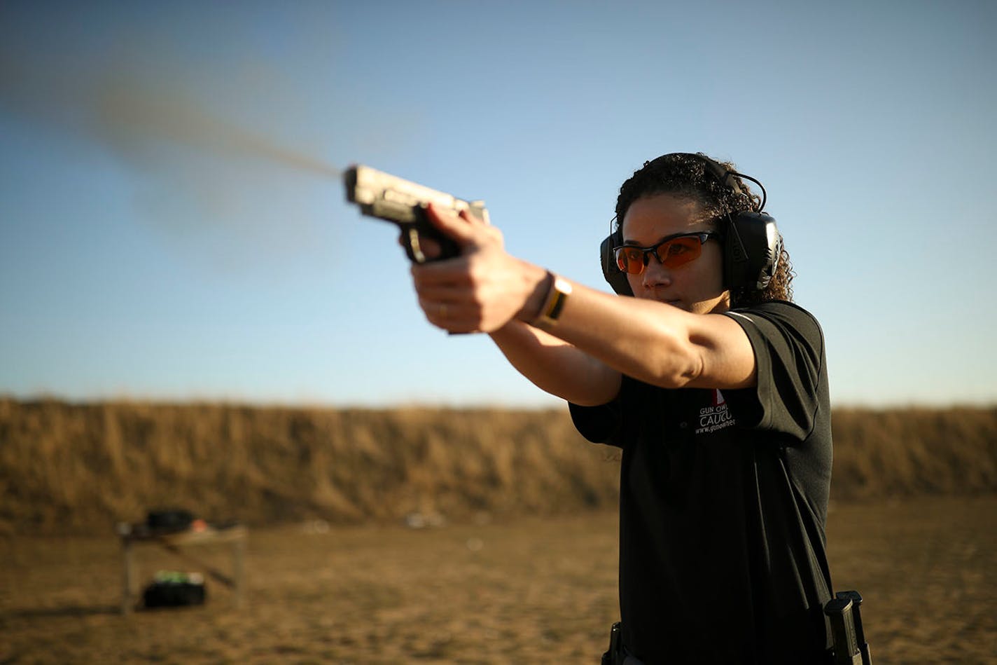 Sarah Cade firing an M&P Pro Series in 9mm semi-automatic pistol at the gun club she belongs to in Cedar. ] JEFF WHEELER ï jeff.wheeler@startribune.com Sarah Cade is a young, bi-racial, liberal woman. She's also a self-described gun nut and gun rights advocate. Cade, a spokeswoman for the Minnesota Gun Owners Caucus, owns an AR-15, shoots competitively, and has a concealed carry permit. Cade was photographed at the Beaverbrook Tri-County Sportsmen's Club in Cedar Thursday evening, April 26, 2018