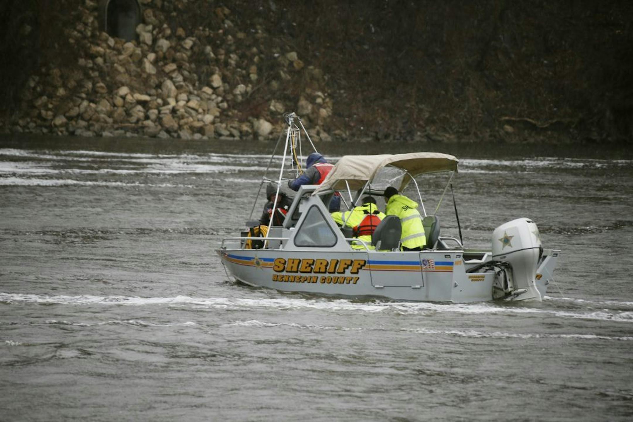 Authorities searched the Mississippi River in Minneapolis on Sunday after a report of a vehicle going into the water and sinking. The search resumed on Monday.