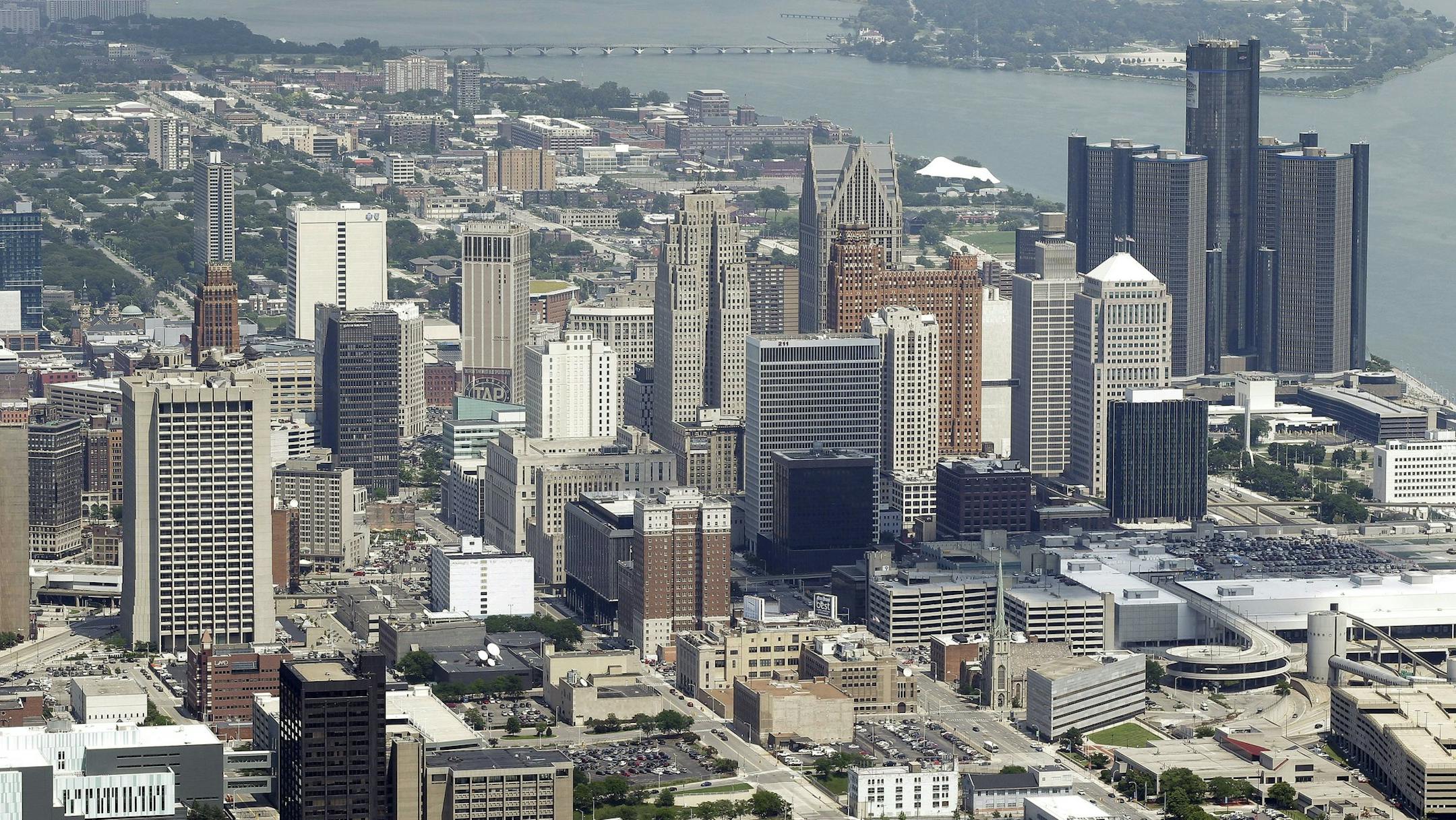 In this July 17, 2013, aerial photo is the city of Detroit. On Thursday, July 18, 2013, Detroit became the largest city in U.S. history to file for bankruptcy when State-appointed emergency manager Kevyn Orr asked a federal judge for municipal bankruptcy protection. (AP Photo/Paul Sancya) ORG XMIT: MIN2013071819214117
