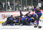 Gentry Academy celebrates after defeating Andover 4-1 in the Class 2A girl's hockey championship Saturday, Feb. 25, 2023 at Xcel Energy Arena in St. P