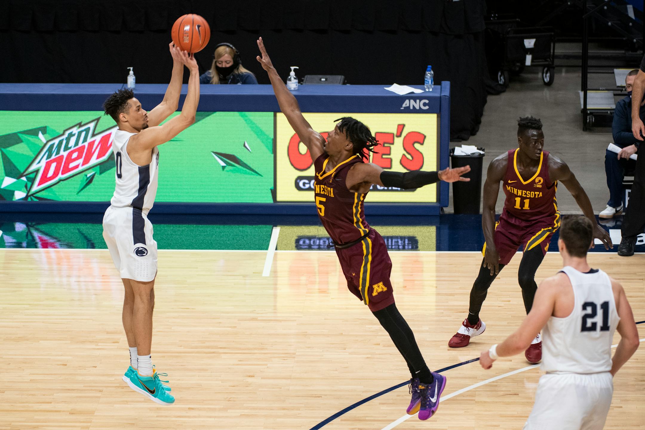Penn State guard Myreon Jones shoots over Gophers guard Marcus Carr during Wednesday's game in State College