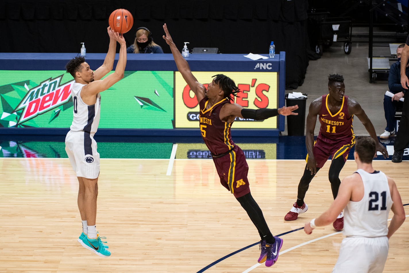 Penn State guard Myreon Jones shoots over Gophers guard Marcus Carr during Wednesday's game in State College